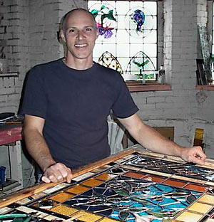 Boston area stained glass artisan Mike Limberakis at work in his studio